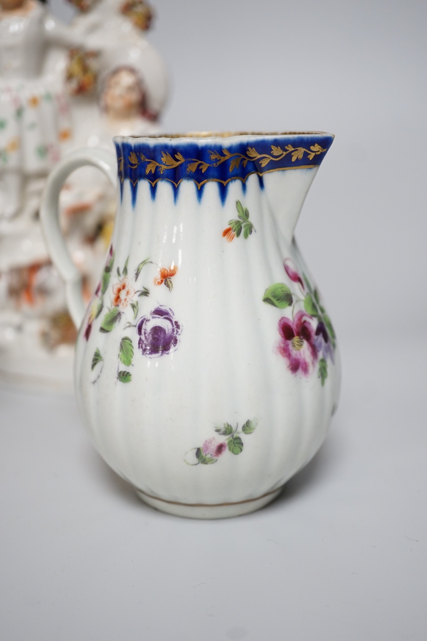 A Worcester milk jug, c.1780, a Newhall-type cream jug, c.1795, a Staffordshire porcelain model of an eagle, c.1830-40, 17cm high, and two Staffordshire porcellaneous models